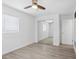 Bedroom featuring neutral walls, gray floors, a mirrored closet and bright natural light at 5758 20Th N Ave, St Petersburg, FL 33710