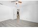 Bedroom featuring neutral walls, wood-look floors and a view into another room at 5758 20Th N Ave, St Petersburg, FL 33710