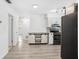 Bright kitchen featuring updated flooring and fixtures, seamlessly connecting to the adjacent spaces at 5758 20Th N Ave, St Petersburg, FL 33710