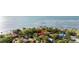 Stunning waterfront home with lush landscaping, private dock, and serene bay views, perfect for a coastal lifestyle at 6305 Bahama Shores S Dr, St Petersburg, FL 33705