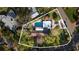 Expansive lot featuring a beautiful pool, lush greenery, and distinctive architecture creating an oasis in a desirable neighborhood at 6305 Bahama Shores S Dr, St Petersburg, FL 33705