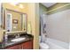 Cozy bathroom featuring a vanity with granite countertops and a shower-tub combo at 689 Chipper Dr, Sun City Center, FL 33573