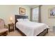 Bedroom featuring a queen sized bed, natural light, and neutral colored walls at 689 Chipper Dr, Sun City Center, FL 33573