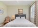 Bedroom featuring a queen sized bed, natural light, and neutral colored walls at 689 Chipper Dr, Sun City Center, FL 33573