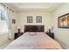 Bedroom featuring a tray ceiling, natural light, a king sized bed and two nightstands at 689 Chipper Dr, Sun City Center, FL 33573