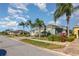 A cozy neighborhood with homes featuring lush landscapes and paver driveways at 689 Chipper Dr, Sun City Center, FL 33573