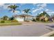 Beautiful home with a lush landscaped lawn and a brick driveway at 689 Chipper Dr, Sun City Center, FL 33573