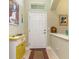 Bright foyer with a tiled floor and neutral paint at 689 Chipper Dr, Sun City Center, FL 33573