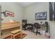 Well-lit office featuring a piano, desk, decor, and stylish interior design at 689 Chipper Dr, Sun City Center, FL 33573
