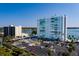 Apartment complex aerial view with parking and waterfront views, surrounded by lush trees at 7200 Sunshine Skyway S Ln # 3D, St Petersburg, FL 33711