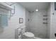Modern bathroom featuring a walk-in shower with glass door and decorative tiles at 7200 Sunshine Skyway S Ln # 3D, St Petersburg, FL 33711