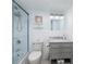 Bathroom features a glass enclosed shower, gray vanity with marble countertop, and modern fixtures at 7200 Sunshine Skyway S Ln # 3D, St Petersburg, FL 33711