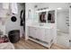 Bathroom and walk-in closet featuring a vanity with great storage and lighting at 7200 Sunshine Skyway S Ln # 3D, St Petersburg, FL 33711