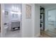 Tastefully updated bathroom featuring modern fixtures, a gray vanity, and convenient in-unit laundry at 7200 Sunshine Skyway S Ln # 3D, St Petersburg, FL 33711