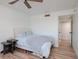 Comfortable bedroom with ceiling fan, and hardwood floors at 7200 Sunshine Skyway S Ln # 3D, St Petersburg, FL 33711
