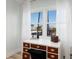 Cozy desk area with view of the beach through double windows at 7200 Sunshine Skyway S Ln # 3D, St Petersburg, FL 33711