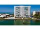 Waterfront building with a pool, dock, and beautiful views of the bay and water at 7200 Sunshine Skyway S Ln # 3D, St Petersburg, FL 33711