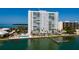 Waterfront building features a pool, lounge area, dock, and beautiful views of the water at 7200 Sunshine Skyway S Ln # 3D, St Petersburg, FL 33711