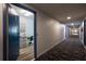 Inviting hallway entrance featuring stylish carpet and a glimpse into the unit with coastal decor accents at 7200 Sunshine Skyway S Ln # 3D, St Petersburg, FL 33711