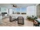 Bright living area with stylish seating, large windows, and a workspace at 7200 Sunshine Skyway S Ln # 3D, St Petersburg, FL 33711