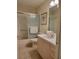 Bathroom with a tub, tile floors, and a vanity with a pink countertop at 7392 Meadow Brook Ln, Spring Hill, FL 34606