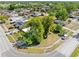 Elevated view of home featuring mature trees and a well-maintained lawn in a serene neighborhood at 7401 Kingston Dr, Tampa, FL 33619