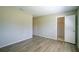 Neutral bedroom showcasing modern floors and an open closet at 7509 Mesa St, North Port, FL 34287