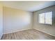 Minimalist bedroom offering modern flooring and bright window light at 7509 Mesa St, North Port, FL 34287