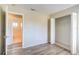 Neutral bedroom showcasing modern floors, closet, and an en suite bathroom at 7509 Mesa St, North Port, FL 34287