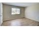 Bright bedroom with neutral walls, updated flooring, and a sun-filled window at 7509 Mesa St, North Port, FL 34287