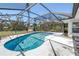 Screened-in pool area with ample space for relaxation and outdoor enjoyment at 823 Bayshore Rd, Nokomis, FL 34275