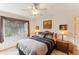 This bedroom has natural light and a neutral color scheme at 8823 Crescent Forest Blvd, New Port Richey, FL 34654