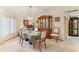 Traditional dining room featuring a classic hutch and ample natural light at 8823 Crescent Forest Blvd, New Port Richey, FL 34654