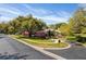 Charming single-Gathering home with curb appeal, featuring mature trees, lush landscaping, and a circular driveway at 8823 Crescent Forest Blvd, New Port Richey, FL 34654