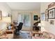 Bright home office featuring a computer desk, comfortable seating, and natural light at 8823 Crescent Forest Blvd, New Port Richey, FL 34654