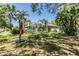 Well-maintained backyard with lush landscaping and a screened-in pool, offering a private retreat at 9302 Deer Creek Dr, Tampa, FL 33647
