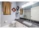 Bathroom featuring a toilet, vanity with granite countertops, and a shower tub combo at 9302 Deer Creek Dr, Tampa, FL 33647