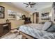 Bedroom with wood flooring, an area rug, modern decor, and a wooden dresser underneath a TV at 9302 Deer Creek Dr, Tampa, FL 33647