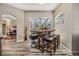 Dining area featuring table, chairs, and large glass doors leading to screened-in pool and patio at 9302 Deer Creek Dr, Tampa, FL 33647