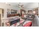 Open-concept living room with contemporary decor, comfortable seating, and access to kitchen area at 9302 Deer Creek Dr, Tampa, FL 33647