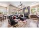 Living room with fireplace, comfortable seating, and natural light streaming through the windows at 9302 Deer Creek Dr, Tampa, FL 33647