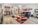 Living room with contemporary decor, comfortable seating, and plenty of natural light at 9302 Deer Creek Dr, Tampa, FL 33647