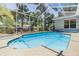 Sparkling screened pool with patio, offering a refreshing oasis for relaxing and entertaining at 9302 Deer Creek Dr, Tampa, FL 33647