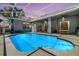 Inviting screened pool with patio and outdoor dining area is perfect for relaxing and entertaining at 9302 Deer Creek Dr, Tampa, FL 33647