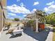 Outdoor patio area with a seating, table, and decorative plants providing relaxation space at 9711 Wydella St, Riverview, FL 33569