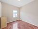 Bedroom with hardwood floors and natural light, creating a bright and inviting living space at 9711 Wydella St, Riverview, FL 33569