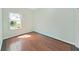 Bedroom with hardwood floors and natural light, perfect for rest and relaxation at 9711 Wydella St, Riverview, FL 33569