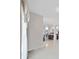 Bright living room with elegant curtains and access to other rooms at 9711 Wydella St, Riverview, FL 33569