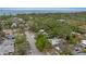 An aerial view of a residential neighborhood with lush greenery and mature trees at 1039 23Rd St, Sarasota, FL 34234