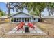 Inviting backyard features a fire pit and Adirondack chairs, perfect for outdoor relaxation at 1039 23Rd St, Sarasota, FL 34234